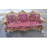 A gilt framed upholstered settee. Approximately 200 cm long.