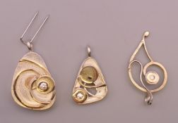 Three Kerry Richardson designer silver brooches. The largest 3 cm high.