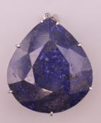 A large silver and lapis pendant. 6 cm high.