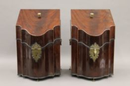 A pair of George III mahogany knife boxes, with fitted interiors. Each 37.5 cm high.