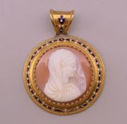 A 19th century boxed unmarked enamel decorated cameo pendant. 5.5 cm high. 15.