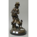 A bronze model of a girl with geese. 33.5 cm high.