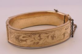 A Victorian gold plated bangle. Interior diameter approximately 6 cm.