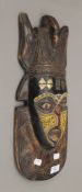 A tribal mask decorated with beads, etc. 47 cm high.
