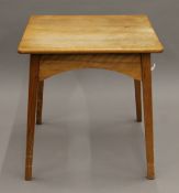 An early 20th century oak side table. 58 cm squared.