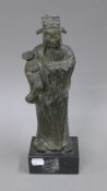 A bronze model of an attendant on a marble base. 31.5 cm high.