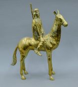 A brass model of a Native American on horseback