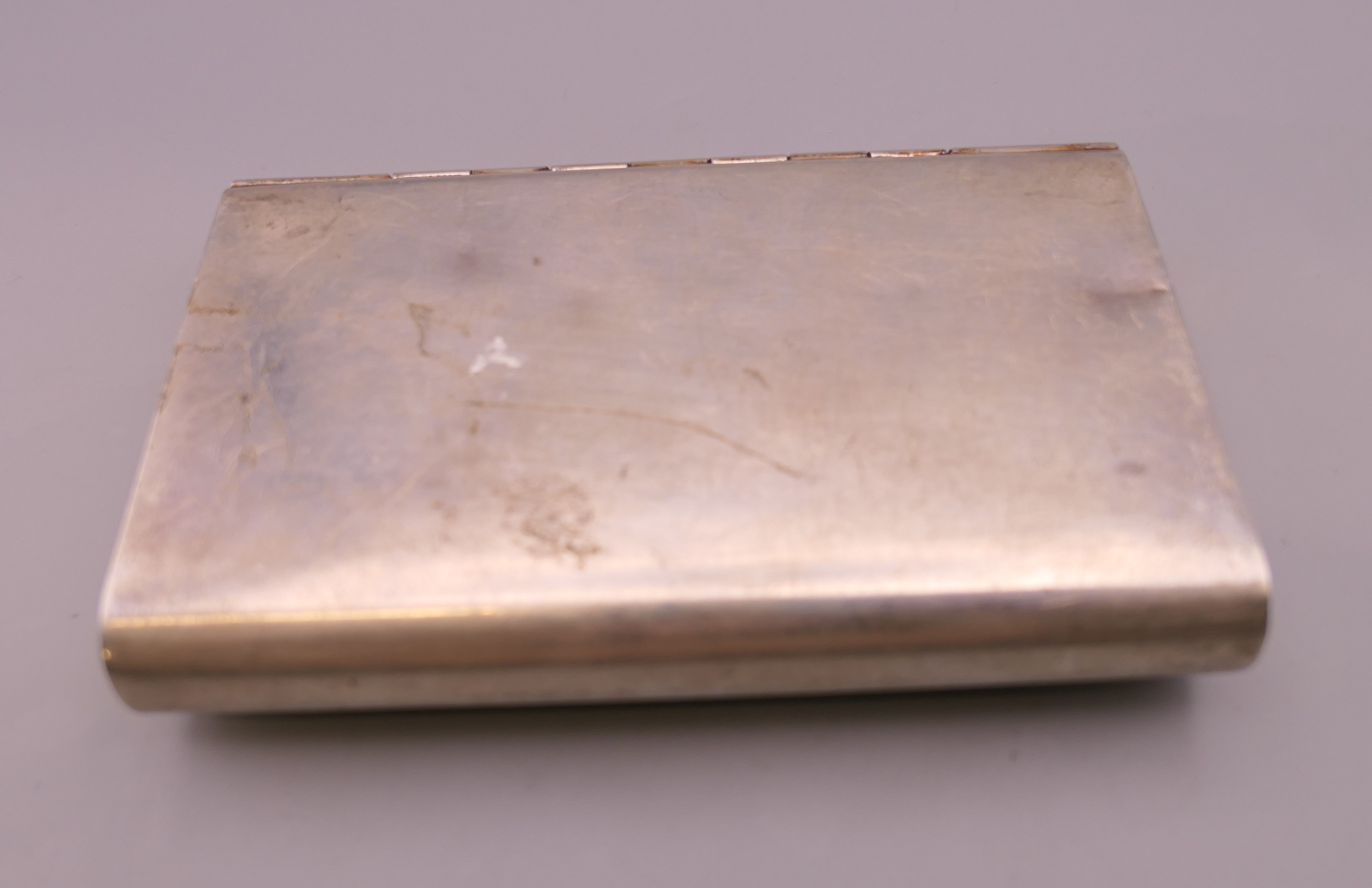 A Cartier sterling silver purse. 10 cm wide. 147.2 grammes total weight. - Image 2 of 7