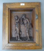 A late 19th century carved wooden panel in an oak frame, inscribed 'Give Us a Light'. 37 x 44.
