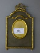 A Victorian brass picture frame, dated 1898. 17 cm high.