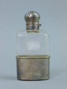 A silver mounted glass spirit flask. 12 cm high.