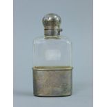 A silver mounted glass spirit flask. 12 cm high.