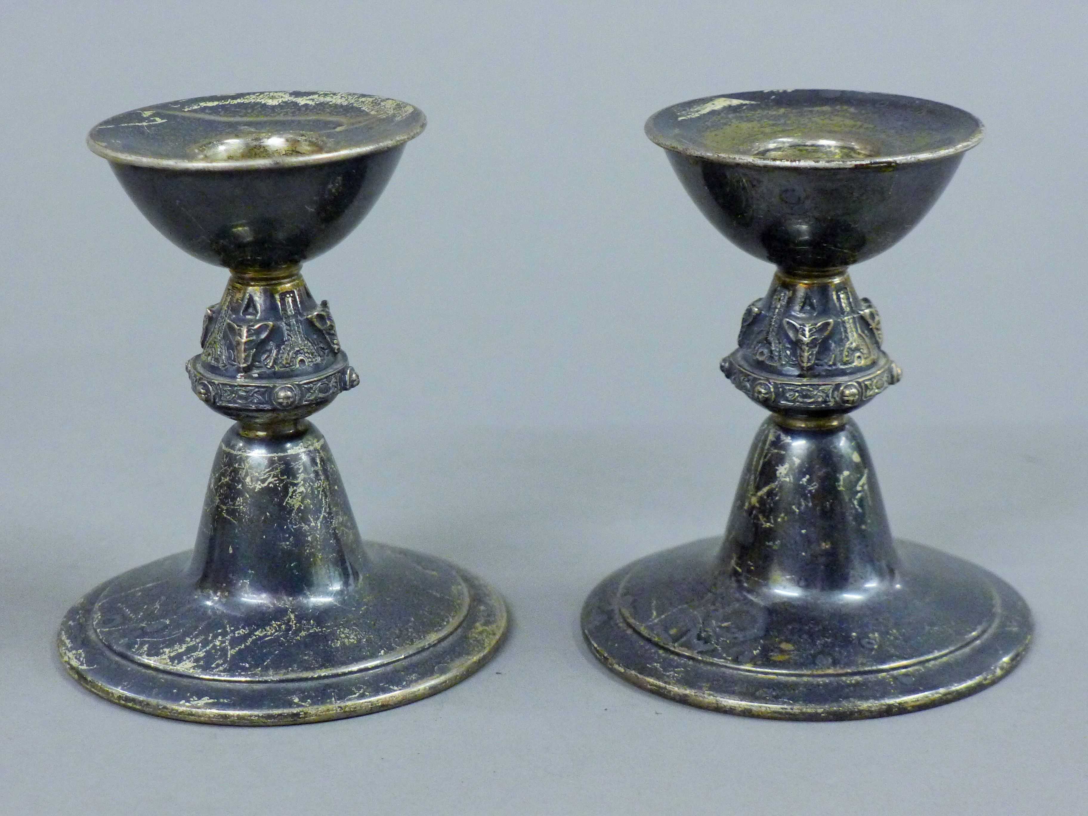 A pair of silver candlesticks. 8.5 cm high. 236.6 grammes.