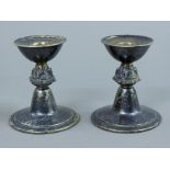 A pair of silver candlesticks. 8.5 cm high. 236.6 grammes.