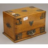 A Victorian oak stationery box. 31 cm wide.