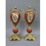 A pair of gilt metal mounted porcelain vases. 47 cm high.