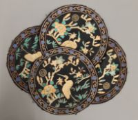 Four circular Chinese embroideries.