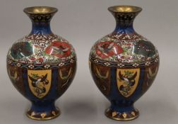 A pair of 19th century Oriental cloisonne vases of bulbous form. 21 cm high.