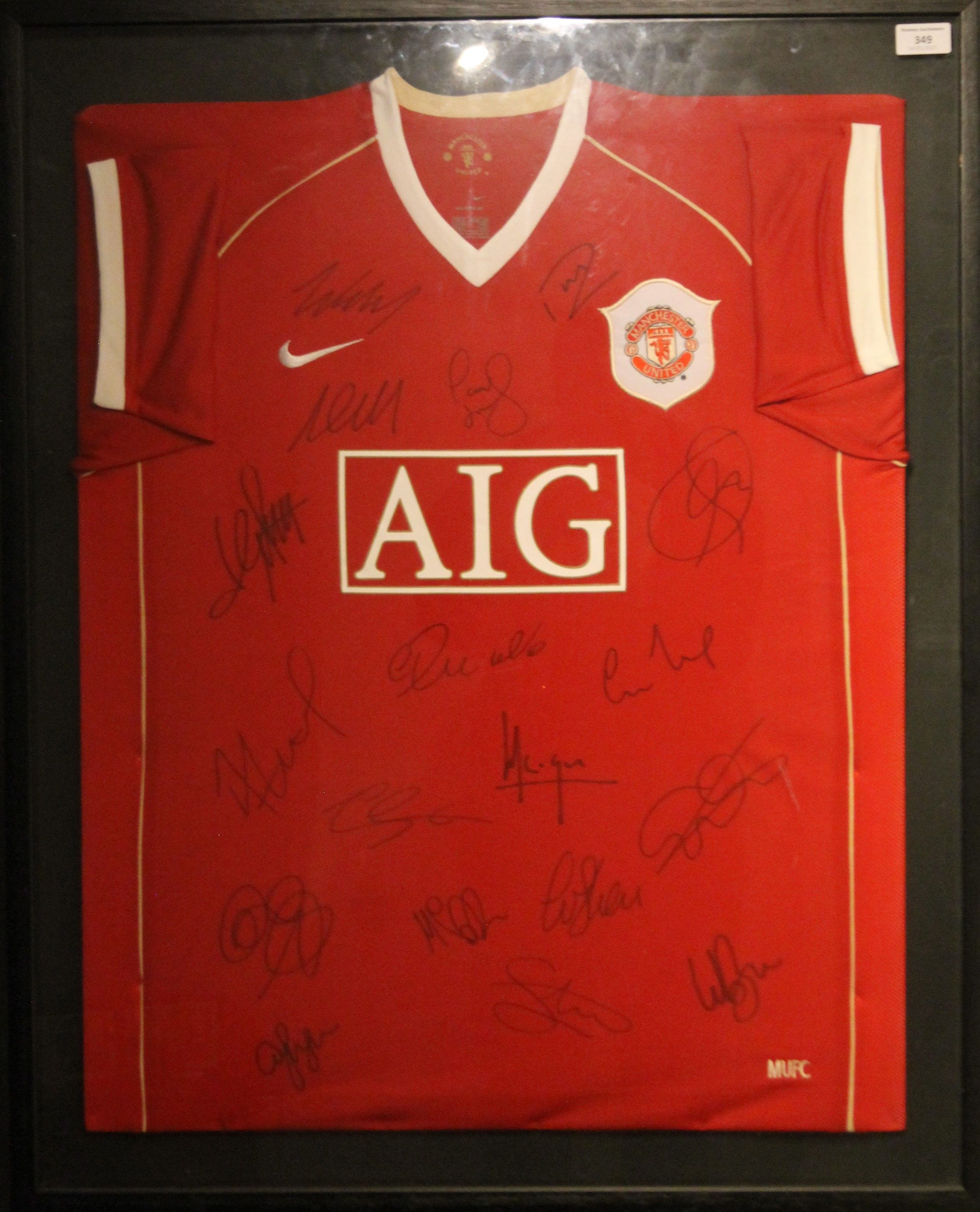 A framed and glazed signed Manchester United F C football shirt with certificate of authenticity. - Image 2 of 2
