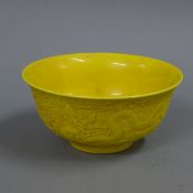 A Chinese yellow porcelain bowl. 15.5 cm diameter.