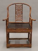 A Chinese bamboo open arm chair. 73 cm wide.