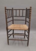 A rush seated bobbin twist chair. 57 cm wide.