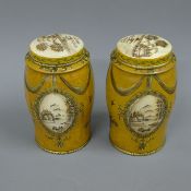 A pair of small toleware tea tins. 16.5 cm high.