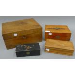 A Victorian walnut writing box, two jewellery boxes and a lacquered box. The former 30.5 cm wide.