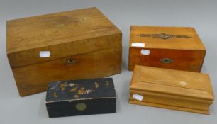 A Victorian walnut writing box, two jewellery boxes and a lacquered box. The former 30.5 cm wide.