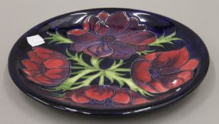 A Moorcroft plate. 25.5 cm diameter.