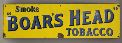 A Boar's Head Tobacco enamel sign. 61 cm long.