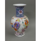 A Chinese porcelain vase decorated with figures. 37 cm high.