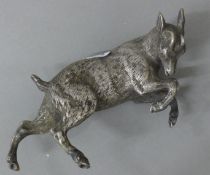 A silver plated model of a goat. 12 cm long.