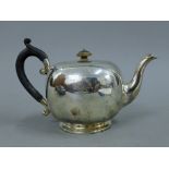 A silver teapot. 15 cm high. 16.7 troy ounces.