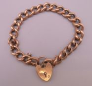 A 9 ct gold bracelet with padlock clasp. 12.9 grammes.