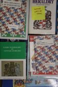 A quantity of heraldry reference books.