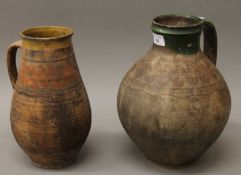 Two 19th century slipware pottery jugs. The largest 29 cm high.