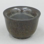 A libation cup. 9.25 cm diameter.