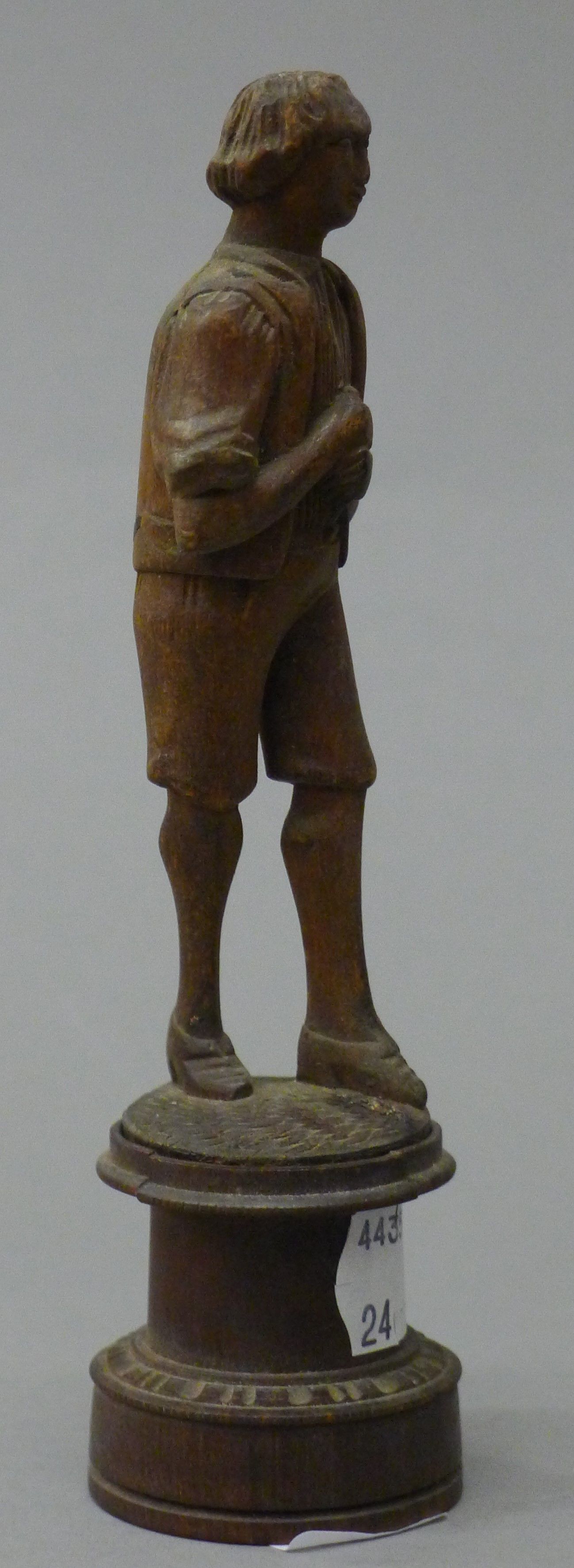 A Blackforest carved figure of a boy. 15 cm high. - Image 2 of 4