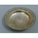 A small silver dish with Regimental inscription. 10.5 cm diameter. 79.7 grammes.