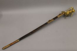 A 19th century Naval sword in scabbard. 97 cm long.