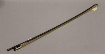 A violin bow branded GEBR Muster Sch No2637. 74 cm long.