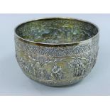 A large embossed Indian silver bowl,