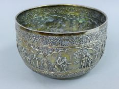 A large embossed Indian silver bowl,