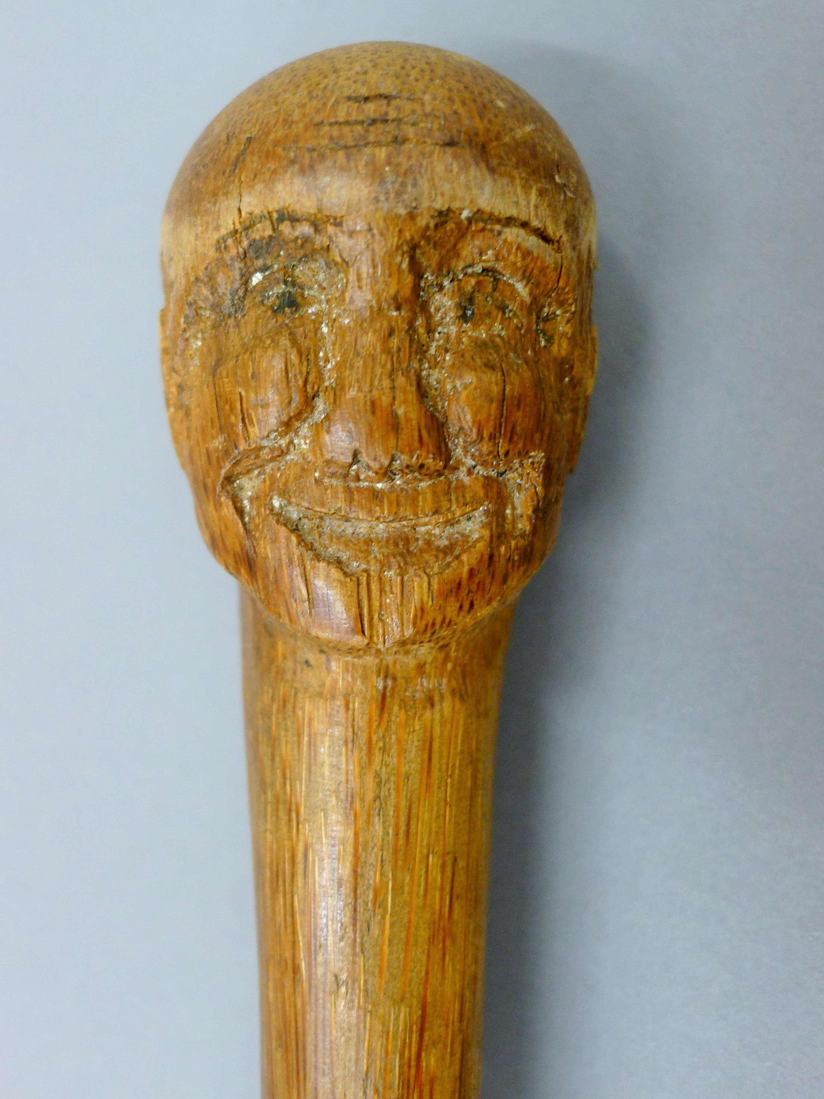 A carved man's head form stick - Image 2 of 3