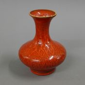 A Chinese red porcelain vase. 13 cm high.