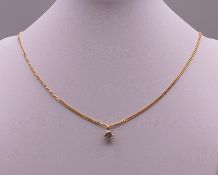 A diamond pendant, the claw set stone spreading to just under 1 carat, mounted on a gold chain.