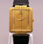 An 18 ct gold Piaget gentlemen's wristwatch. 2.5 cm wide. 31.1 grammes total weight.