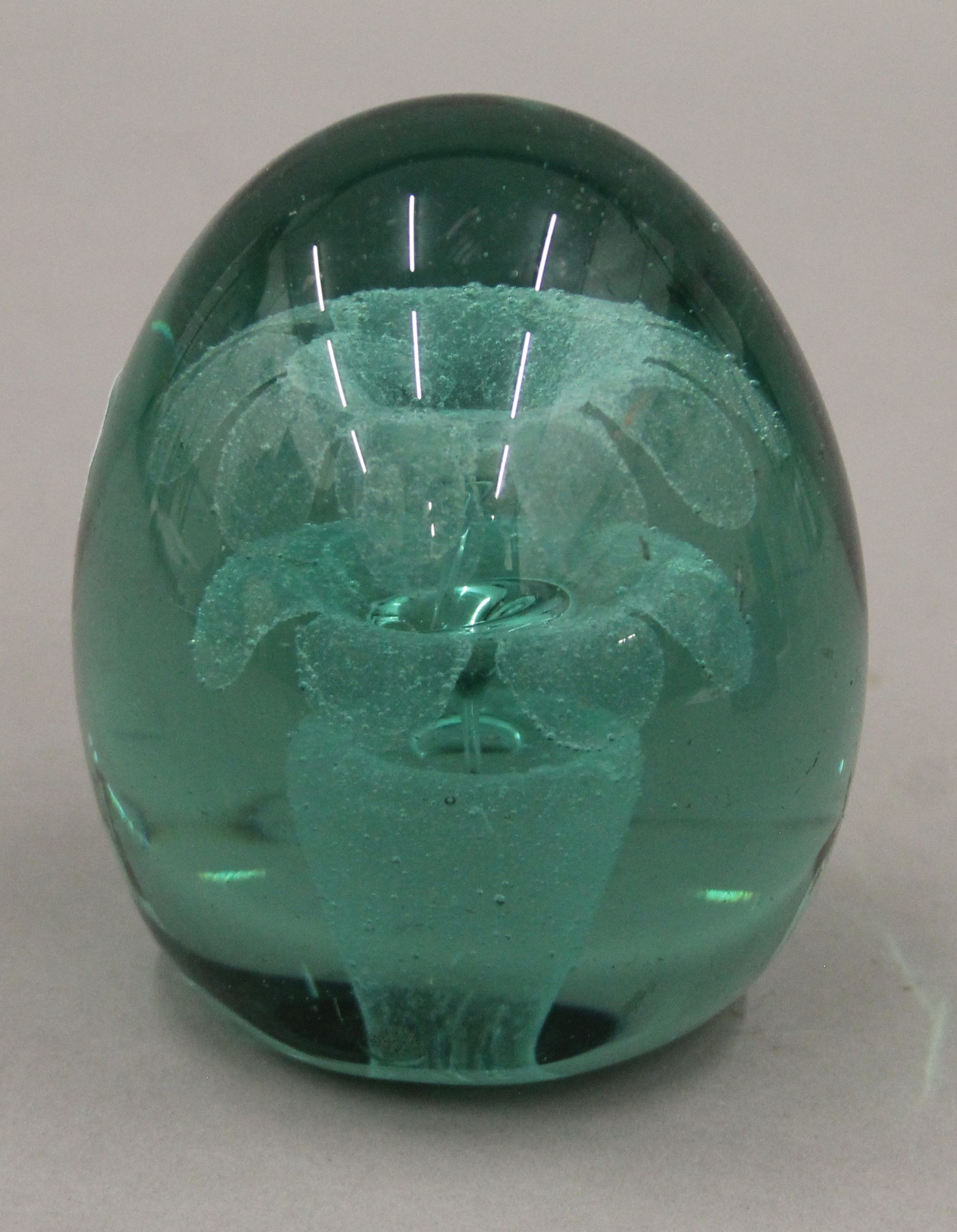 A Victorian end of the day glass dump weight. 9.5 cm high.