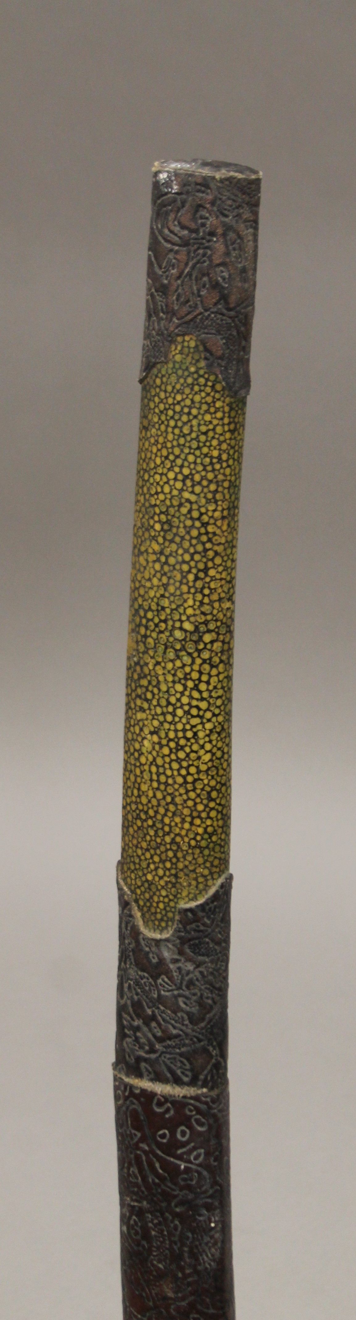 An Oriental sword in scabbard. 122.5 cm long. - Image 2 of 4